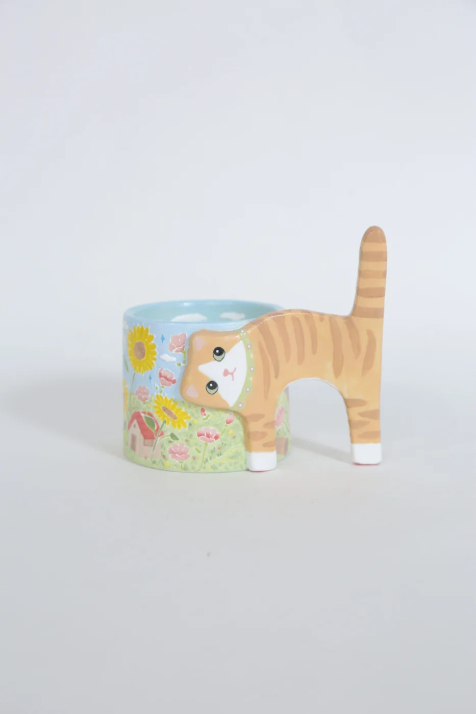 Orange cat ceramic cup with a sunflower landscape
